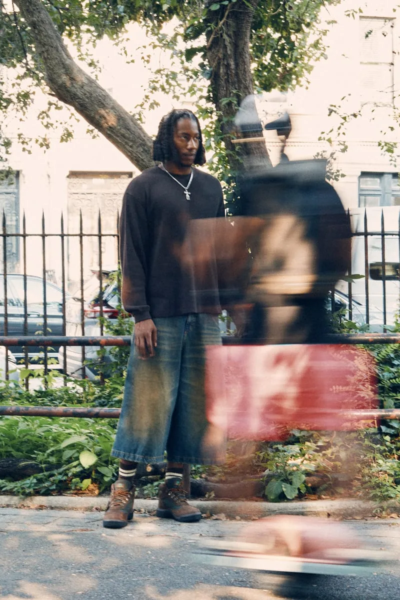 on-foot full body, man standing near tree with motion-blurred passerby, Timberland Field Boot