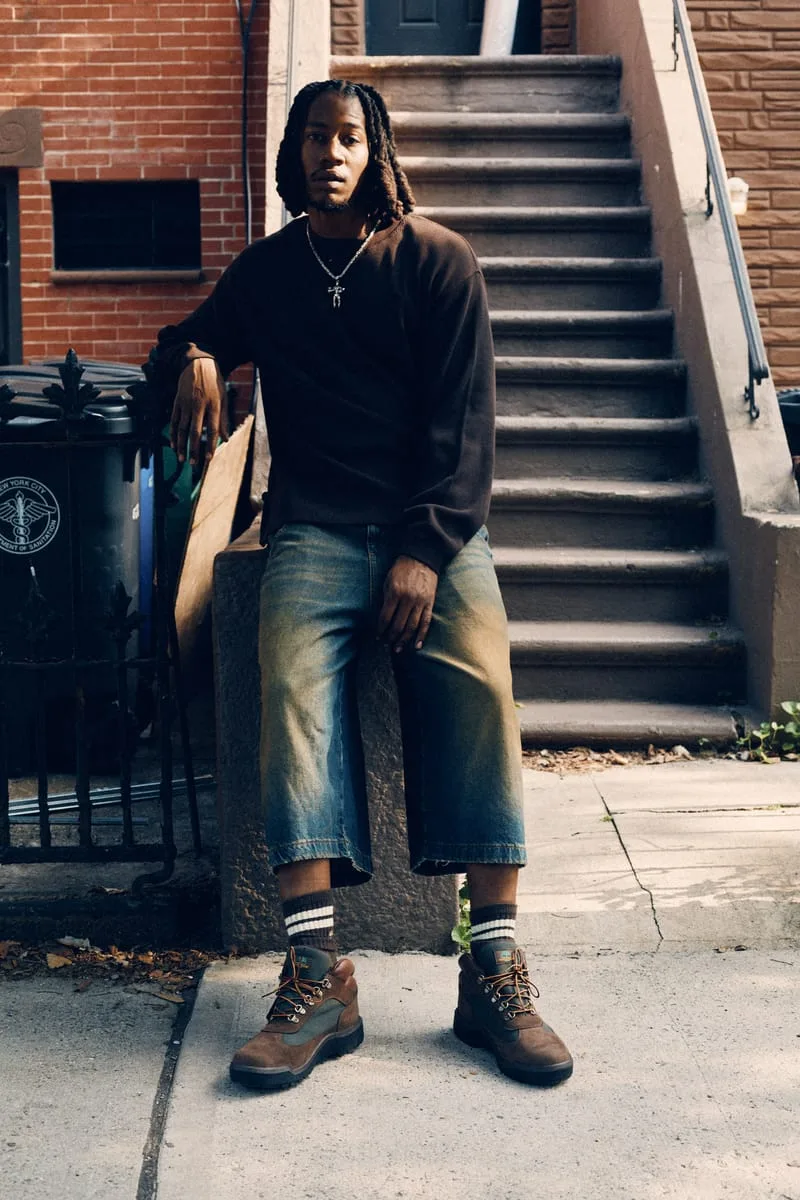 on-foot full body, man standing by stoop with trash cans and stairs, Timberland Field Boot
