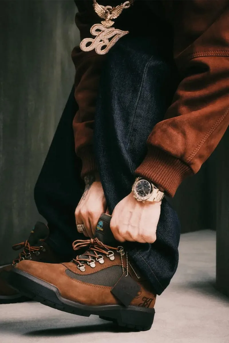 on-foot detail, tying orange laces, brown leather sleeve and gold jewelry, Waterproof Field Boot