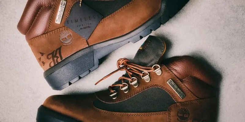 close lateral view, tan nubuck, black overlay, silver Timberland tag, Waterproof Field Boot