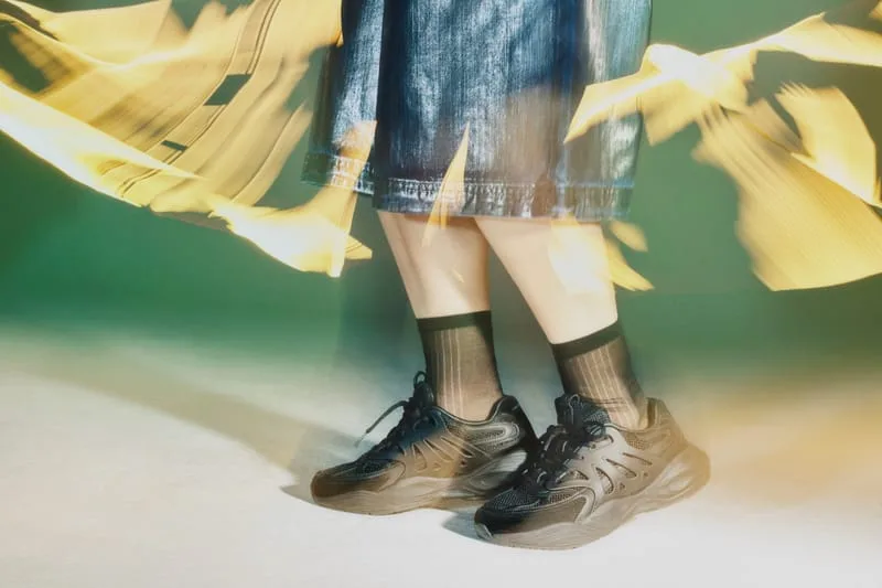 on-foot close-up, black pair with sheer black socks, green backdrop, yellow motion blur, Tomorrowland WR1