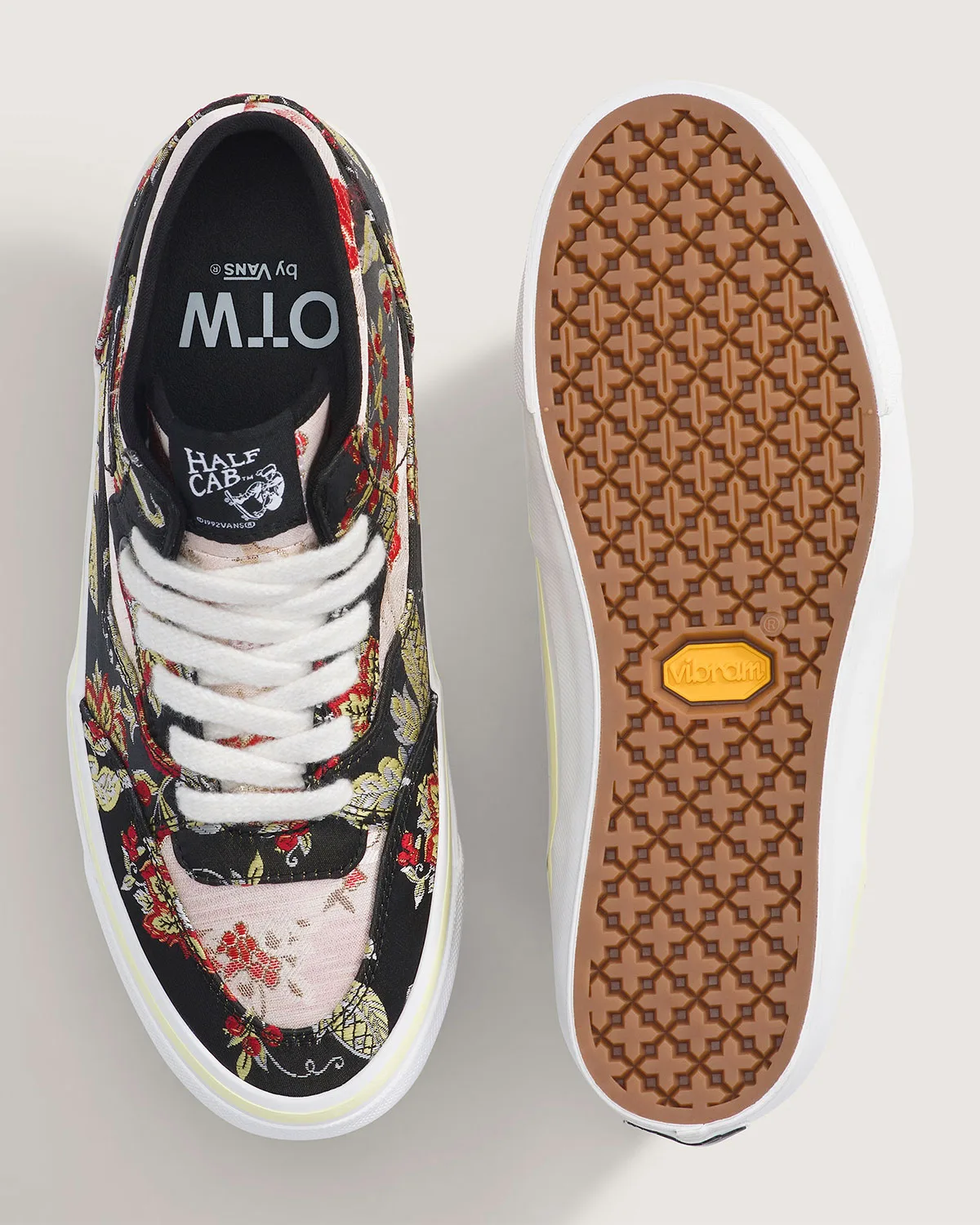 top-down pair, black floral upper beside gum Vibram waffle outsole, Floral Tapestry