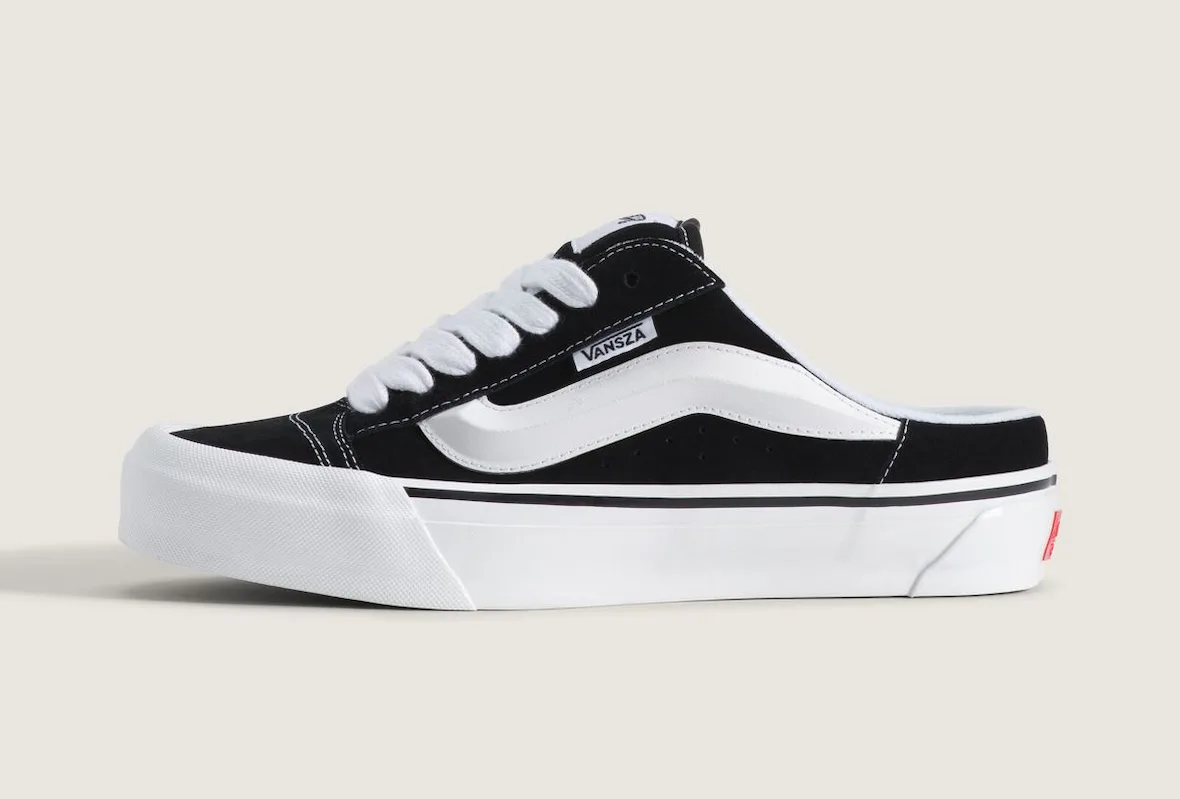 lateral view of black suede slip-on mule with white sole and VANSZA tab, SZA VANSZA Collection