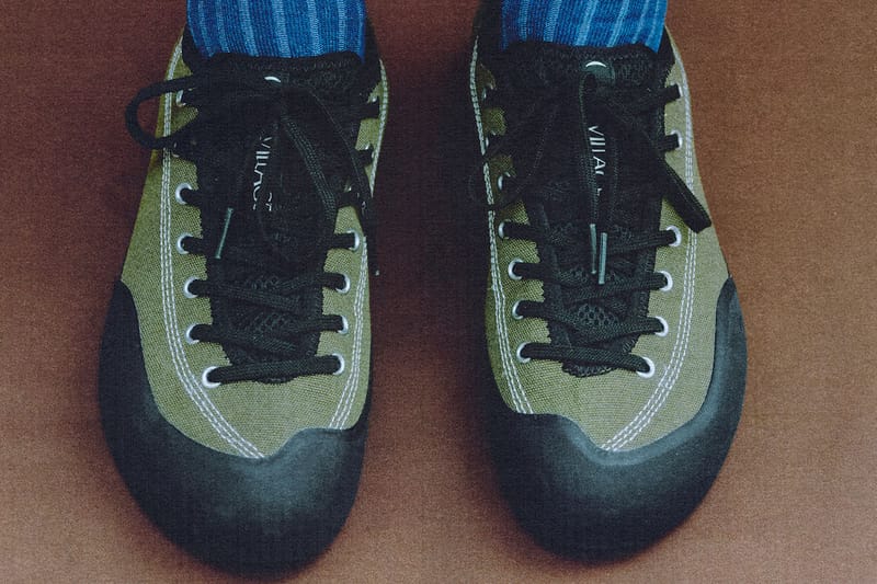 on-foot top-down toe view, olive canvas pair with black toe caps, blue socks, VILLAGE PM 2PM