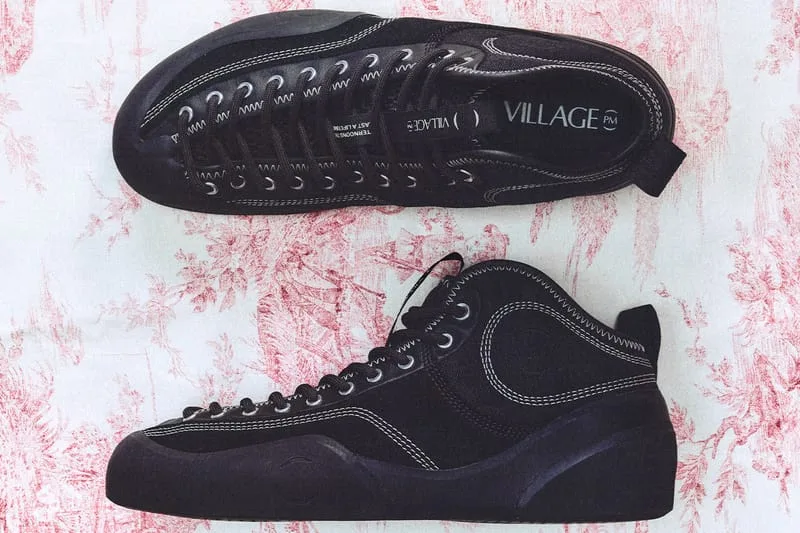 lateral and outsole view, black suede pair on red floral fabric, VILLAGE PM text, VILLAGE PM 2PM
