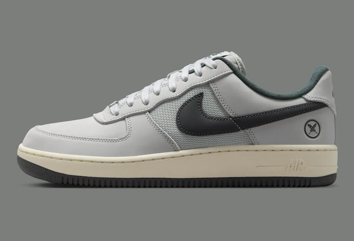 lateral view, grey leather upper, dark grey swoosh, teal suede collar lining, Iron Grey
