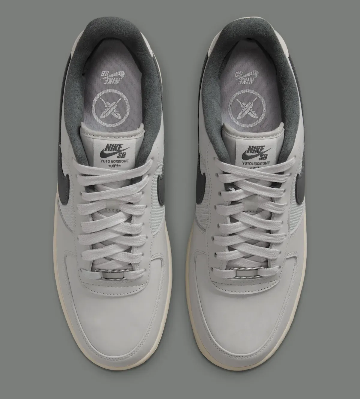 top-down pair, laces undone, X logo and Nike SB print on grey insoles, Iron Grey