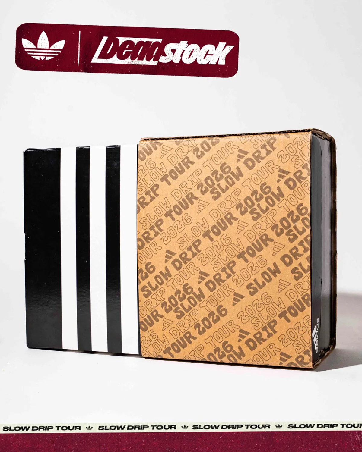 Packaging, black box with white three stripes beside a Slow Drip Tour 2026 cardboard sleeve, x Deadstock Coffee