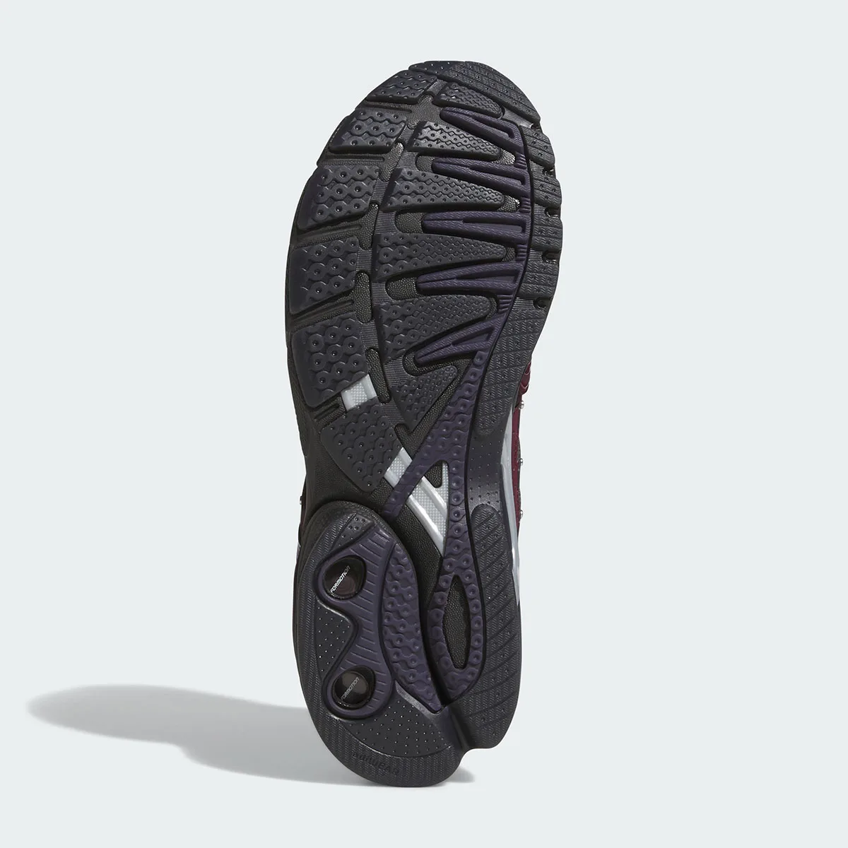 Outsole view in dark grey and purple with chunky tread and two round heel cutouts, 5 x Hardies