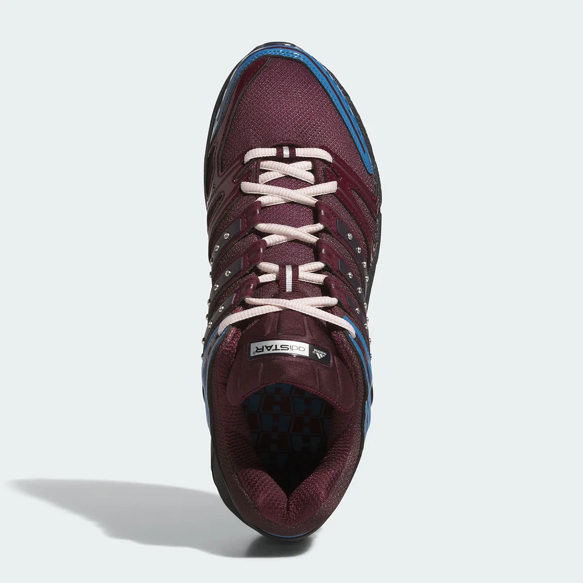 Top-down view of pink crossed laces, maroon upper, blue trim and adistar tongue label, 5 x Hardies