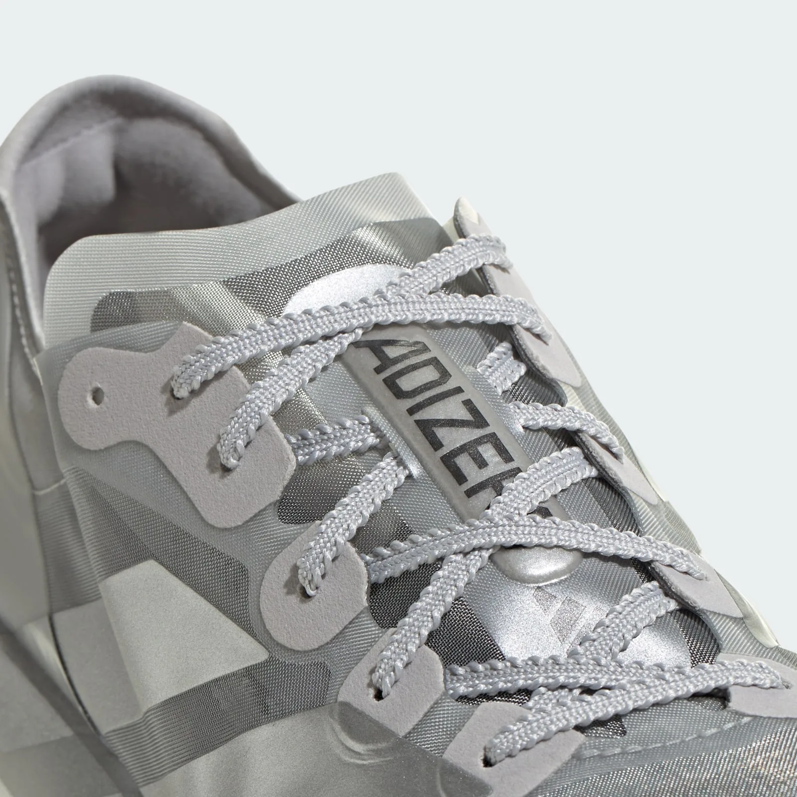Close-up of grey laces, ADIZERO tongue text and translucent silver mesh upper, 2 x Satisfy