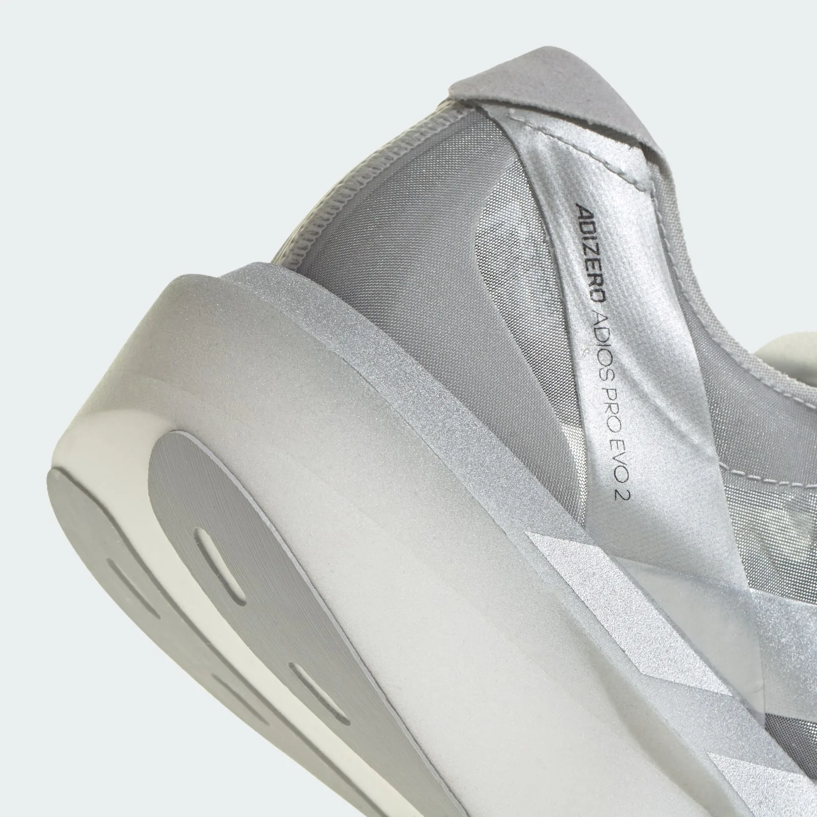 Heel detail with ADIZERO ADIOS PRO EVO 2 text, silver stripes and cutout outsole, 2 x Satisfy