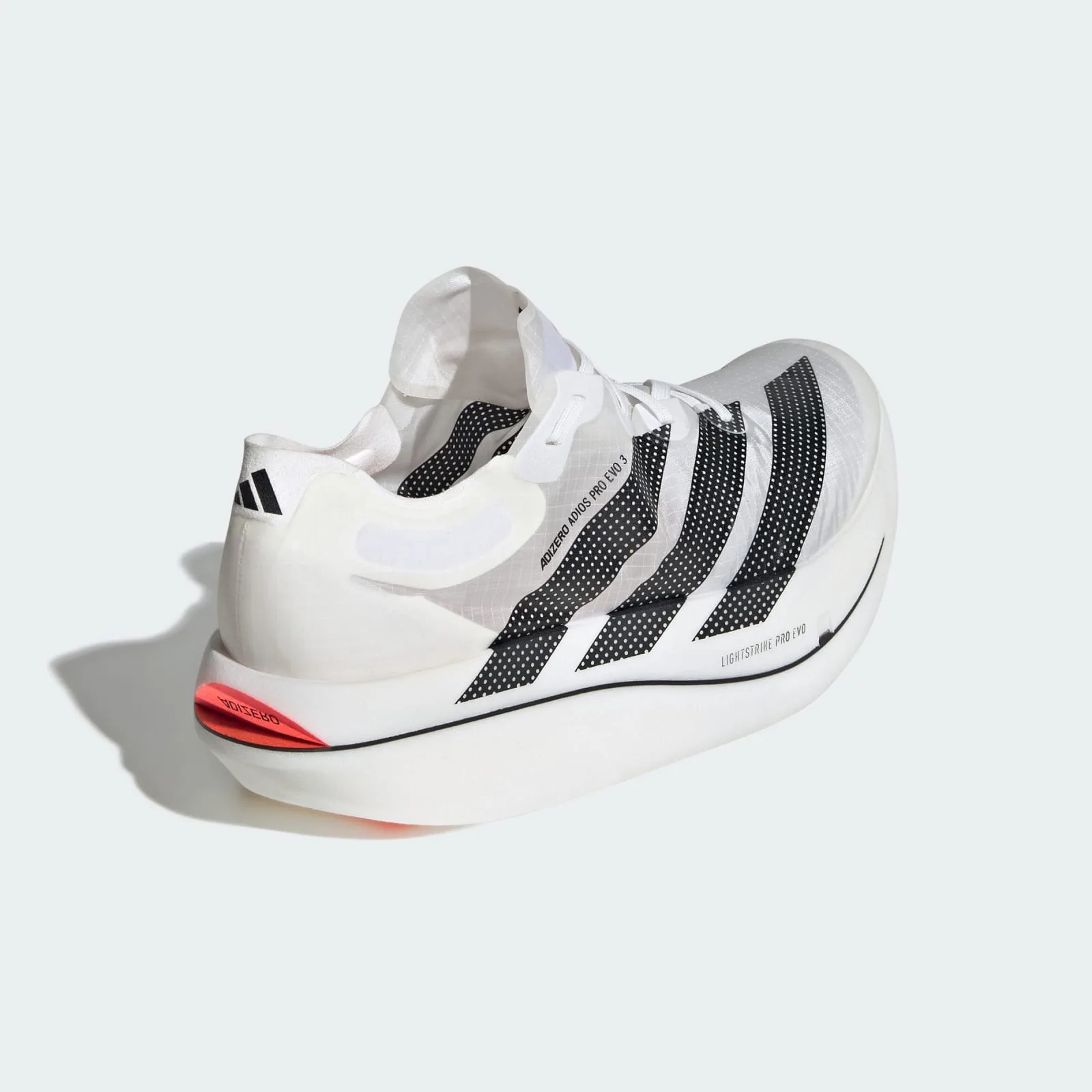 Heel and rear three-quarter view, black dotted stripes, orange-red heel tab reading Adizero, Pro EVO 3