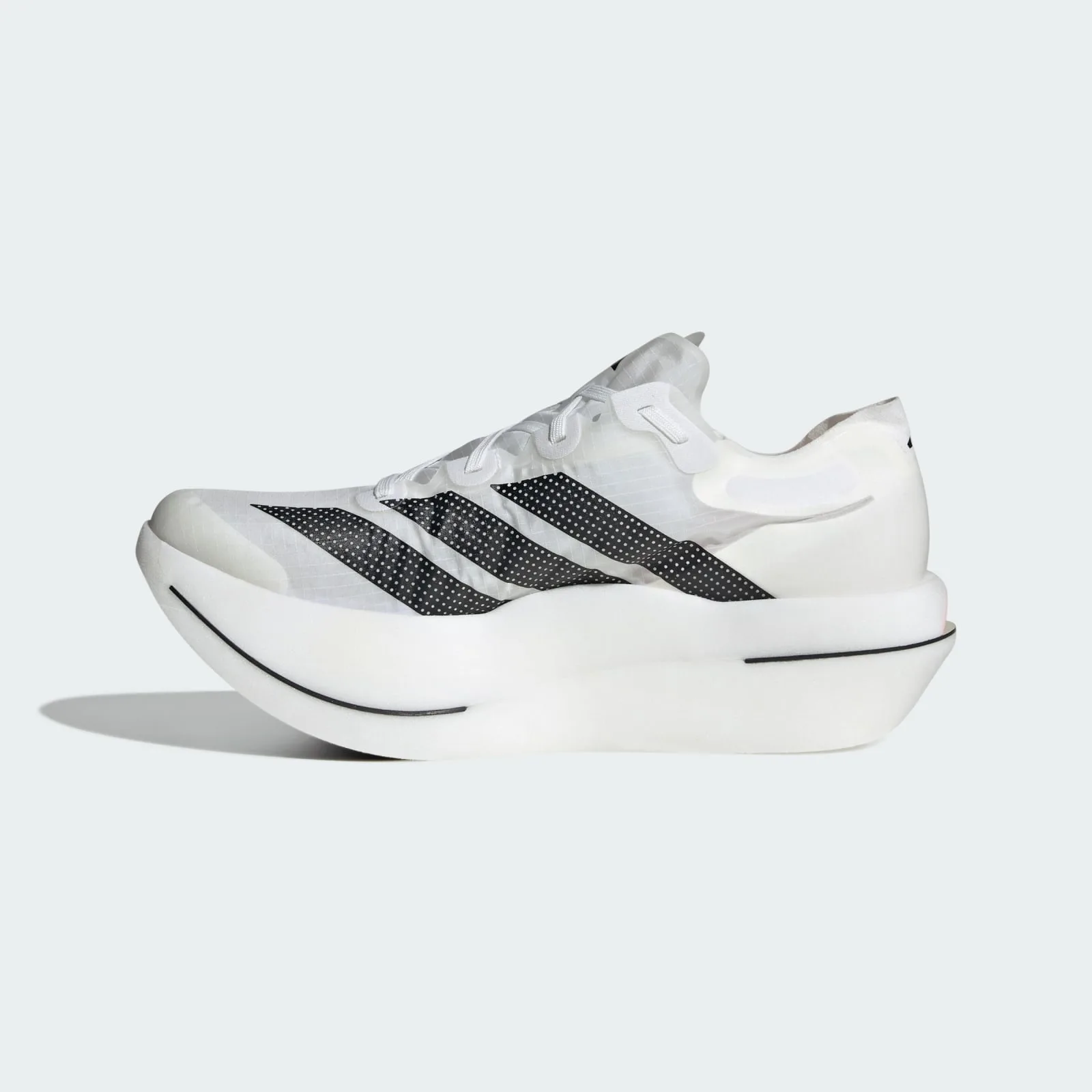 Medial side view, white shoe with black dotted stripes and a thick, curved white midsole, Pro EVO 3