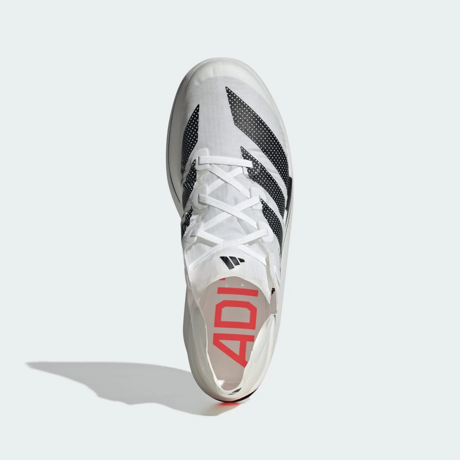 Top-down view, white laces, black dotted stripes, red Adi lettering on insole, orange heel tip, Pro EVO 3
