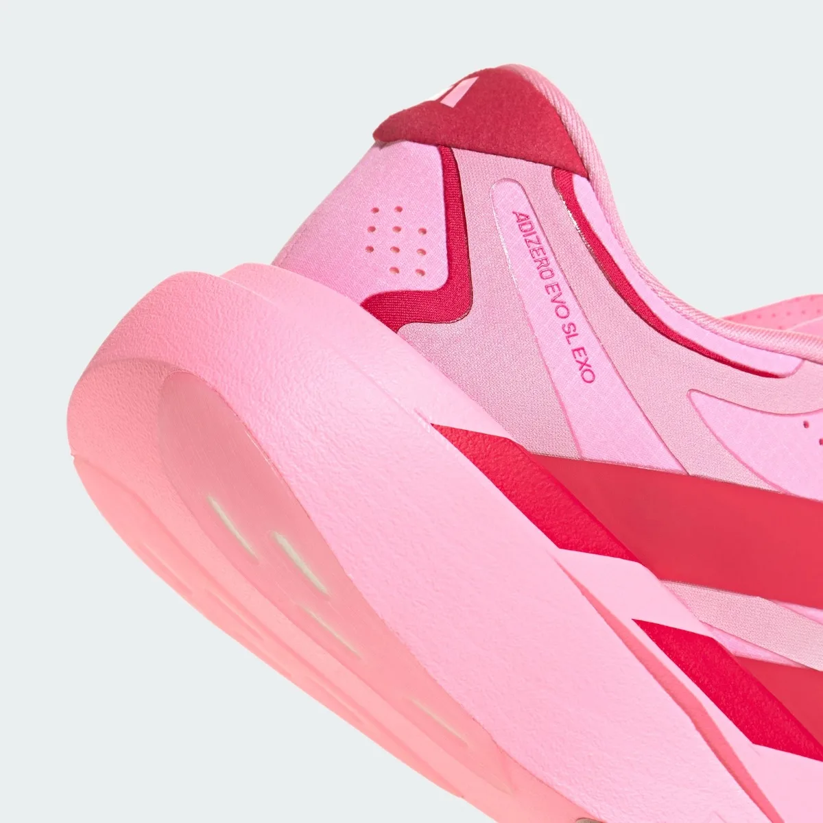 Heel detail with Adizero Evo SL Exo text, red heel tab and chunky pink midsole, Pink Glow Hearts