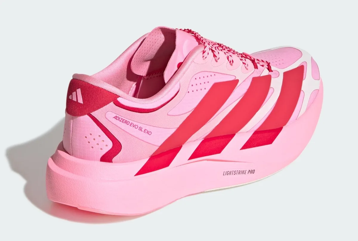 Rear three-quarter view showing red heel tab with logo and Adizero Evo SL Exo text on pink upper, Pink Glow Hearts