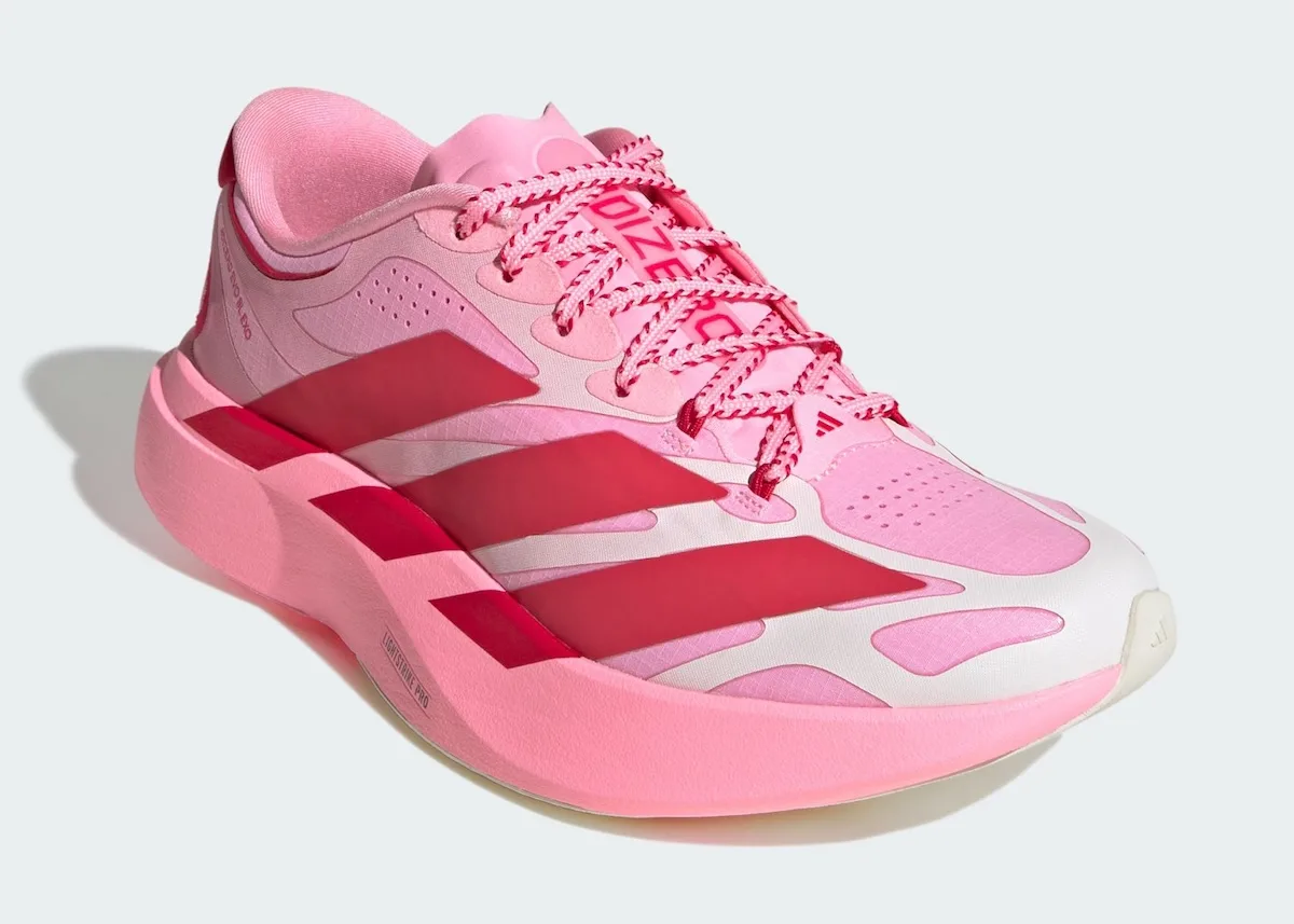 Front three-quarter view of pink and white upper with red stripes and pink-and-red striped laces, Pink Glow Hearts
