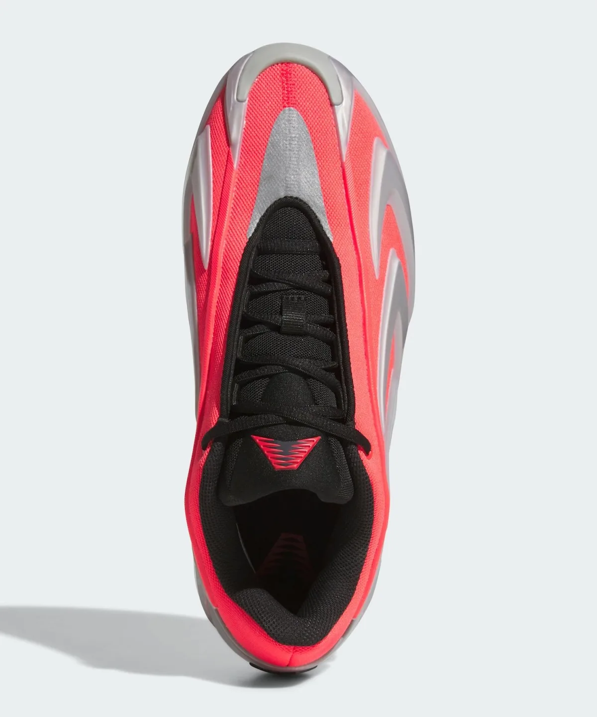 Top-down view, red upper with black laces, silver toe panel and red chevron logo, Omen
