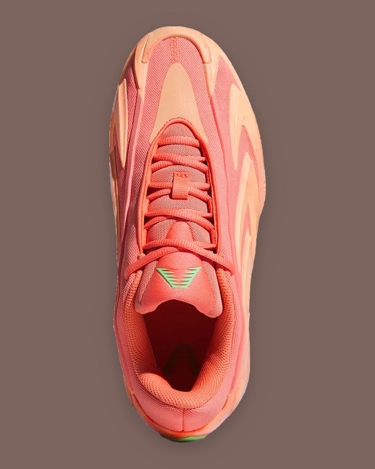Top-down view, coral laces and green tongue logo, orange interior, peach overlays, With Love