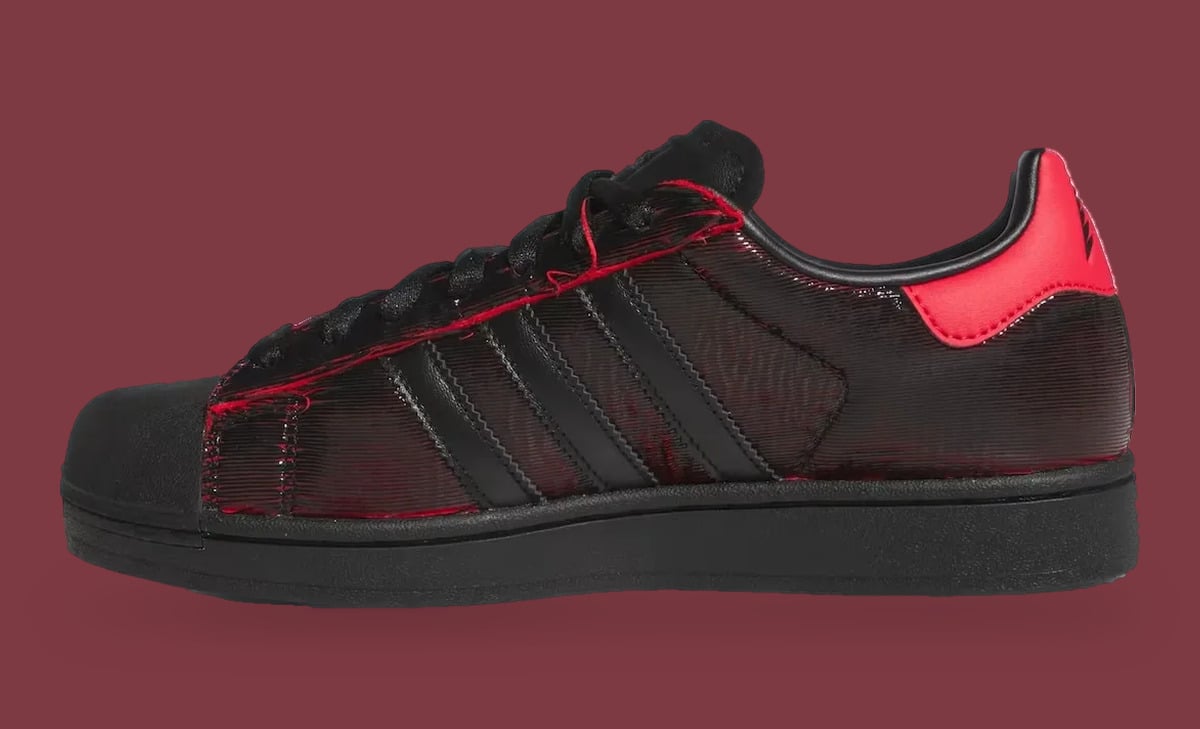 Lateral view with black three stripes, red edge stitching and a red heel tab on maroon, Halloween