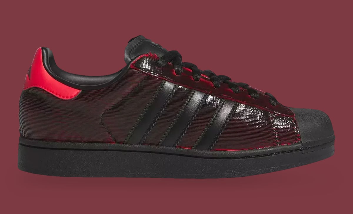Medial view, glossy ridged black-red upper with black three stripes and red heel tab, Halloween