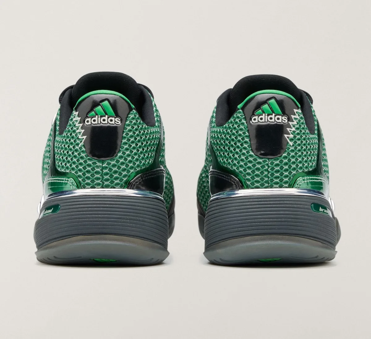 Heel view of pair, green mesh with black heel tab, adidas logo and zigzag stitching, x Brain Dead