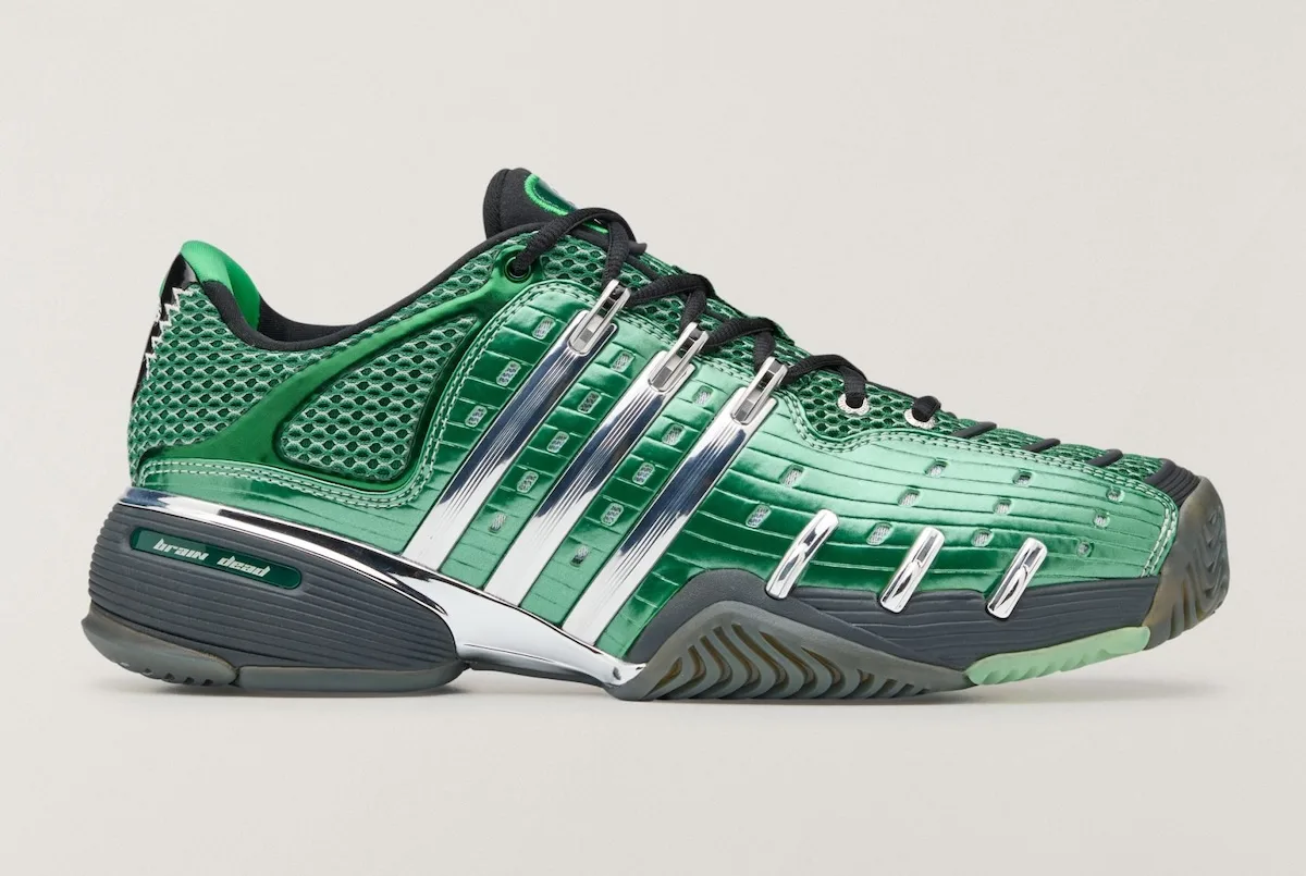 Lateral view of green shoe with glossy metallic upper, chrome three stripes, grey outsole, x Brain Dead