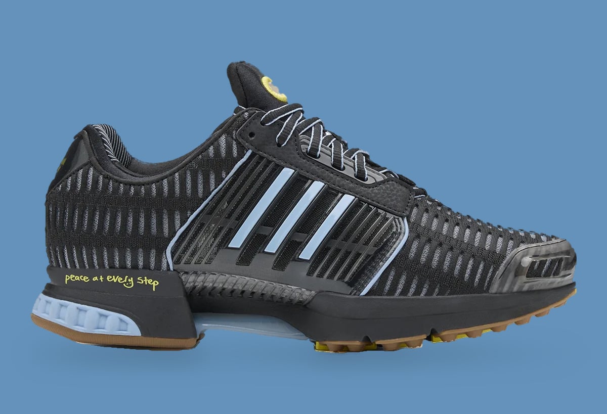 Lateral view of black mesh sneaker with pale blue stripes, light blue heel and gum outsole, Climacool x ADWYSD