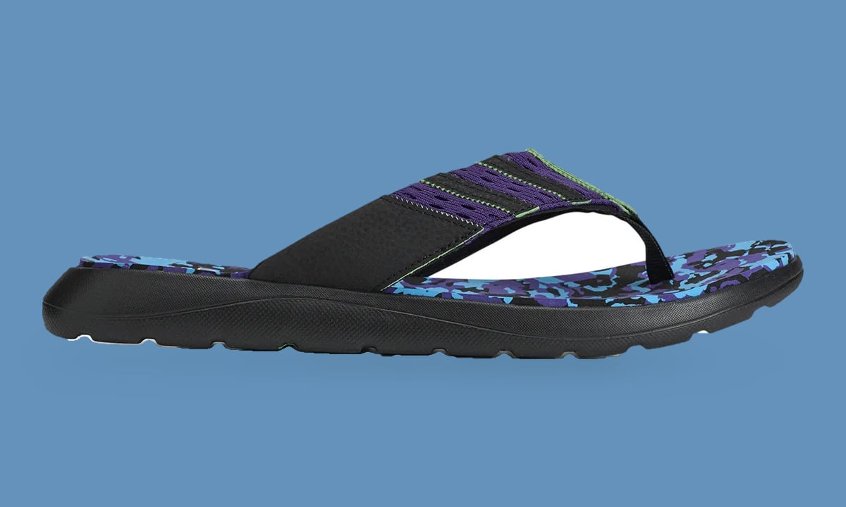 Lateral view of black flip-flop with purple strap and blue and purple camo footbed on blue backdrop, Climacool x ADWYSD