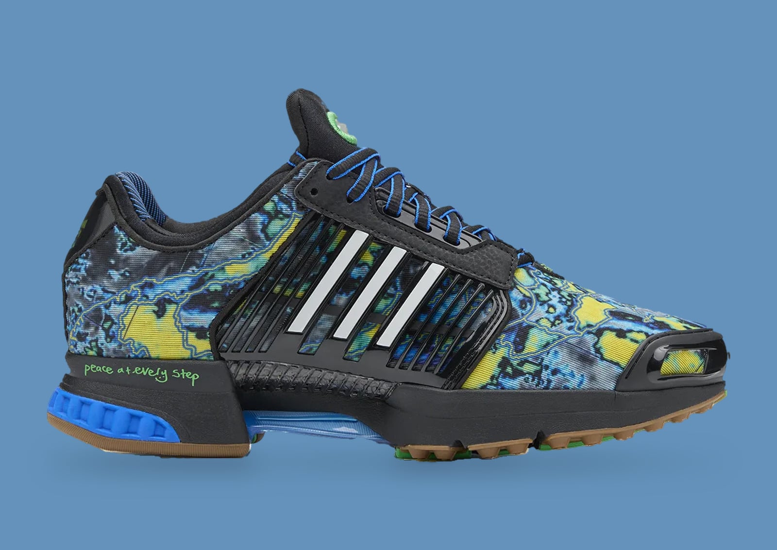Lateral view of black sneaker with blue, yellow and green marbled print, white stripes, blue heel, adidas Climacool x ADWYSD