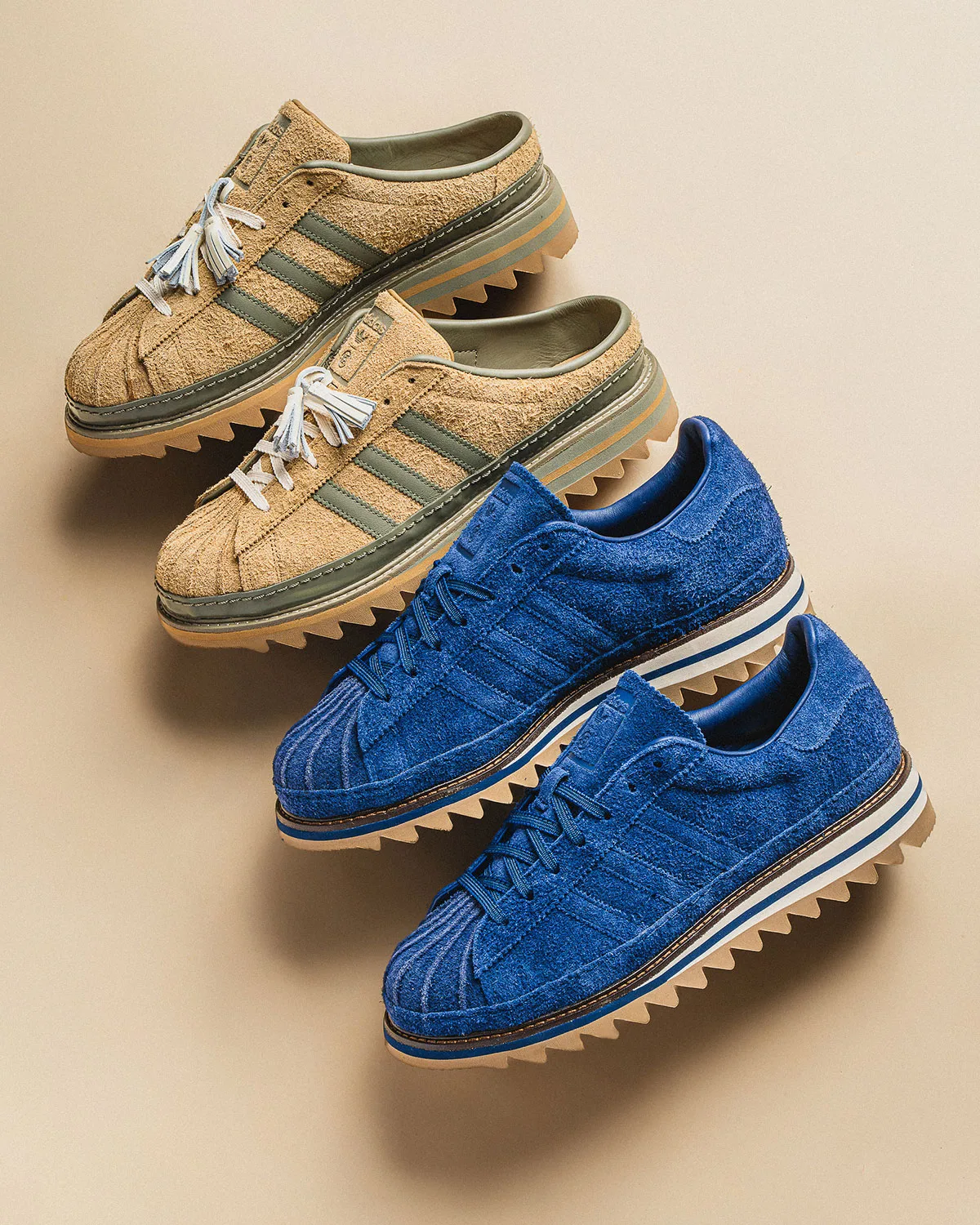 Two pairs side by side: tan suede mules above, blue suede sneakers below, on beige backdrop, Mule x CLOT