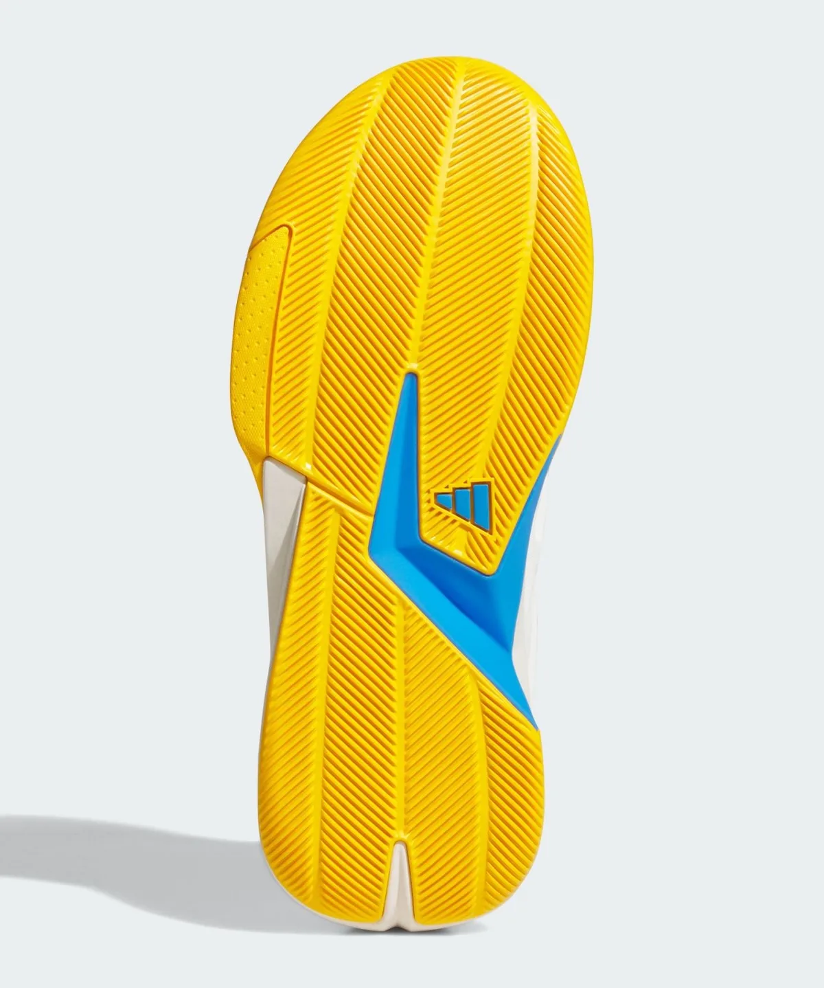 Outsole view of yellow herringbone traction with a blue shank piece and adidas logo, Wagner Brothers