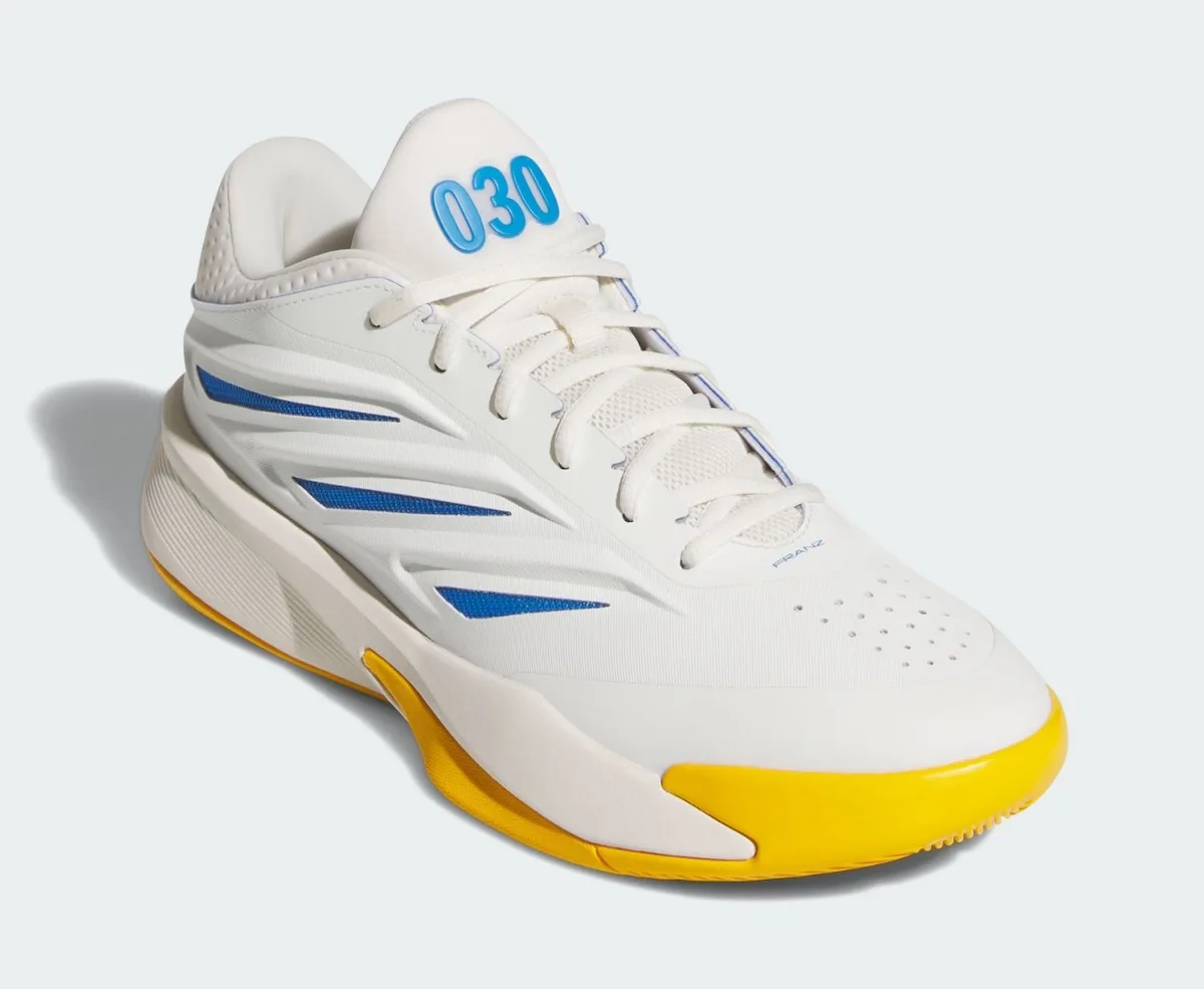 Front three-quarter view showing blue 030 on the tongue, blue stripes and yellow toe, Wagner Brothers