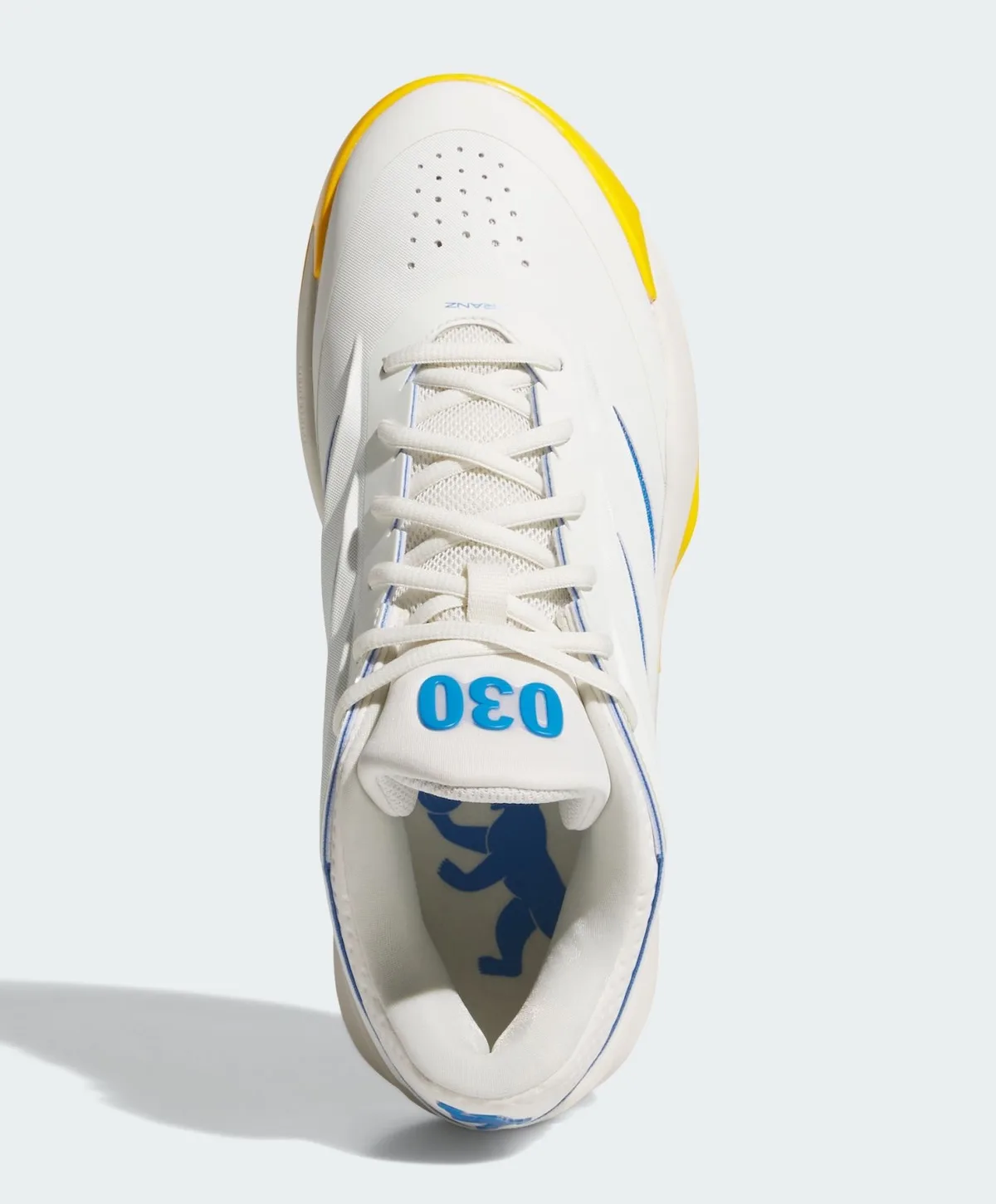 Top-down view of white laces, blue 030 on the tongue and a blue bear inside, Wagner Brothers
