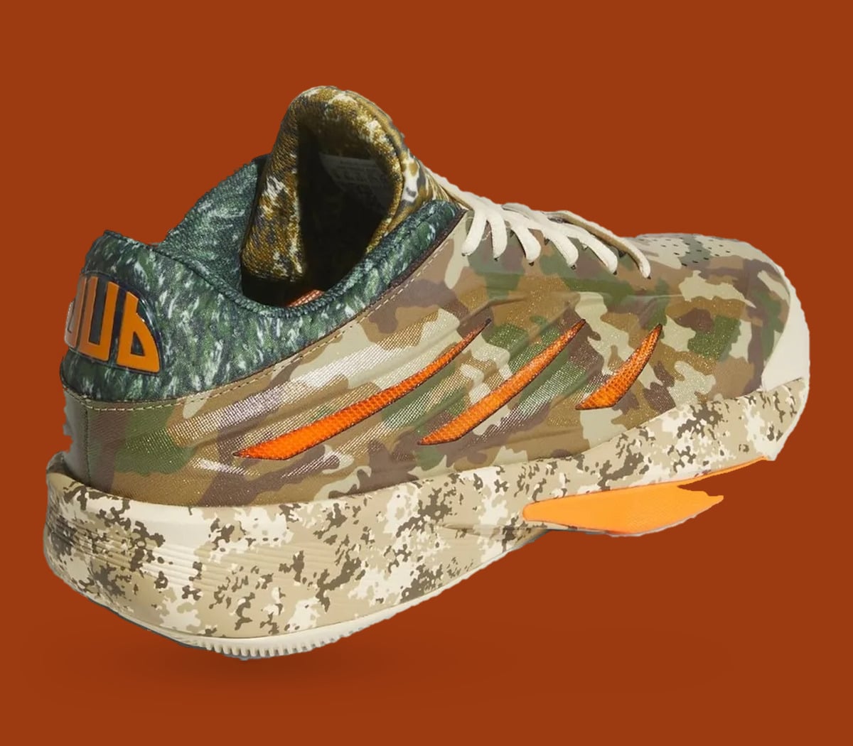 Heel three-quarter view, orange heel tab lettering, camo upper and digital-camo midsole, What The Camo