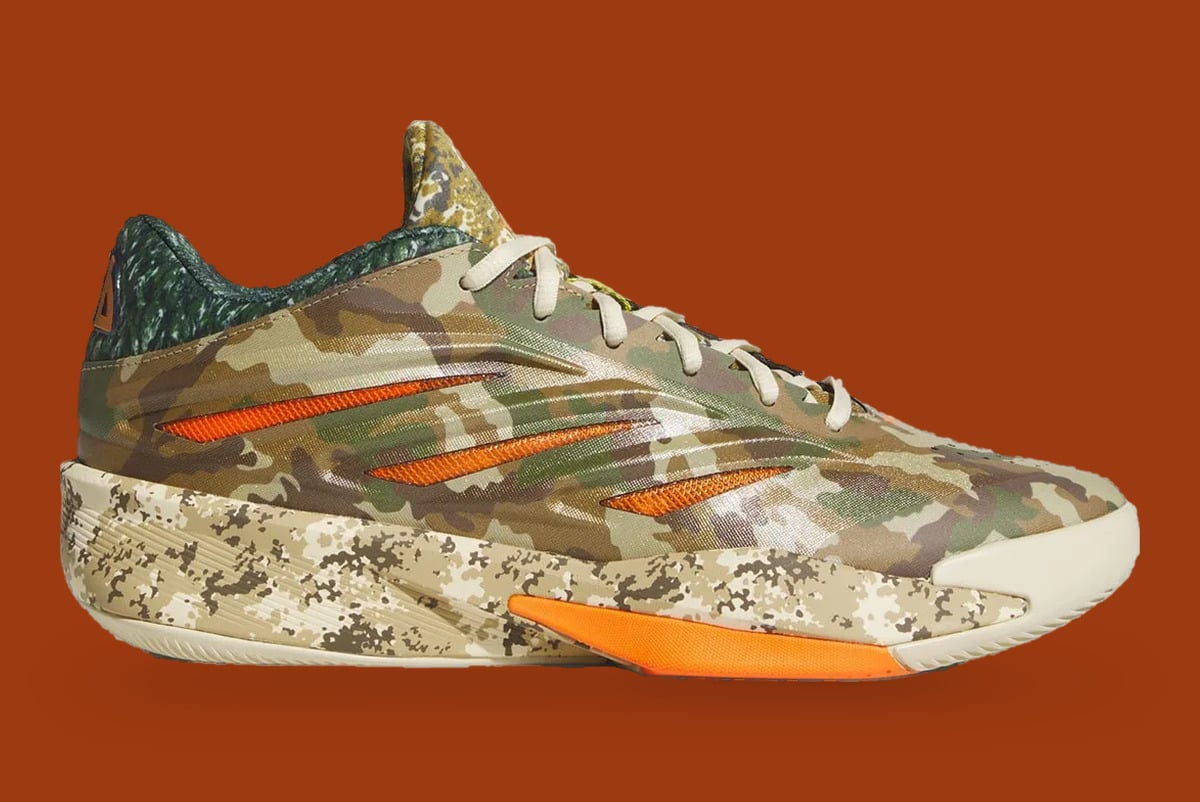 Lateral view, woodland camo upper, three orange stripes, orange heel insert, What The Camo