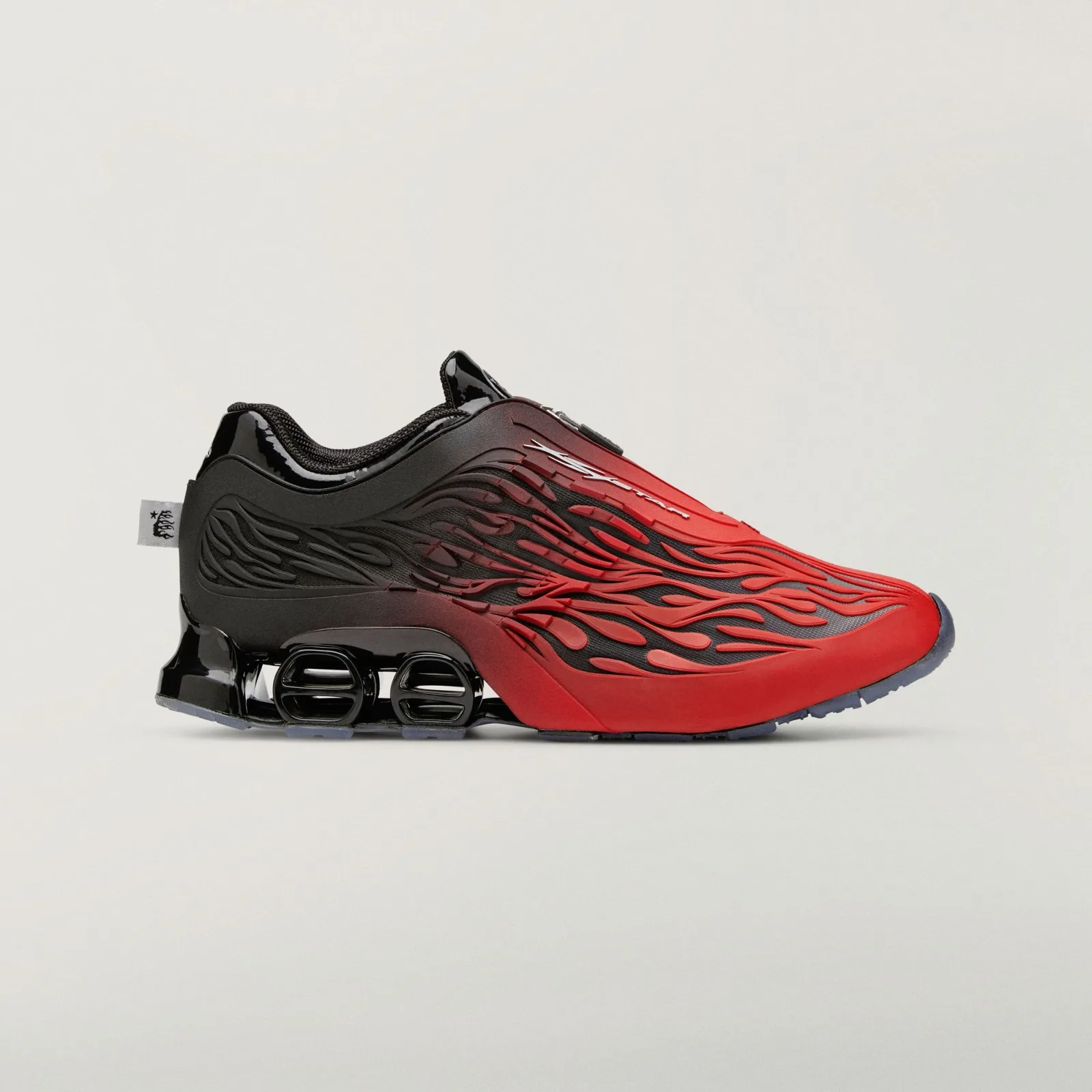 Lateral view of red-to-black gradient with raised flame overlays and twin black heel pods, Red/Black