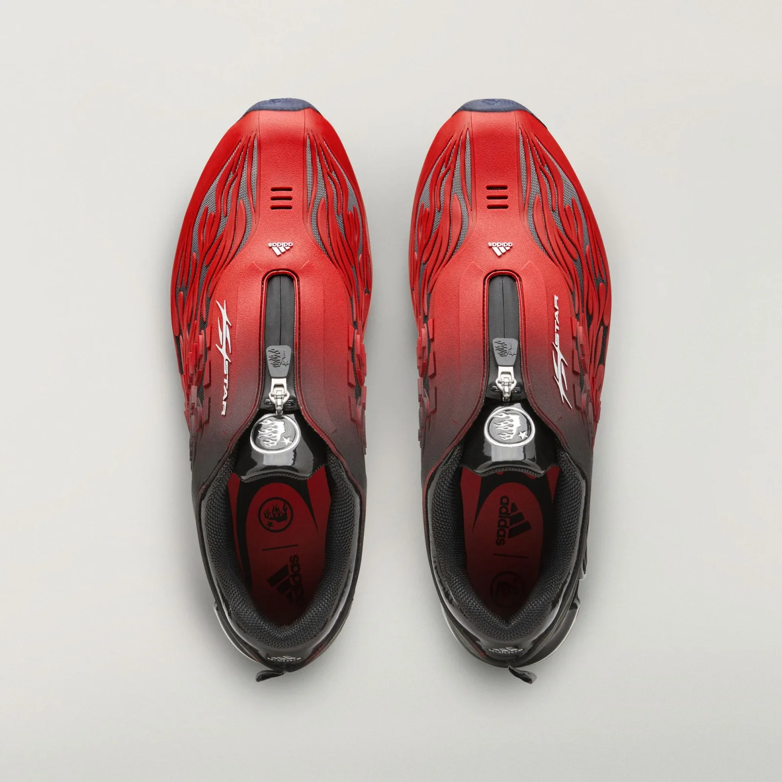 Top-down pair with front zips, silver flame-head badges, red insoles and adidas branding, Red/Black