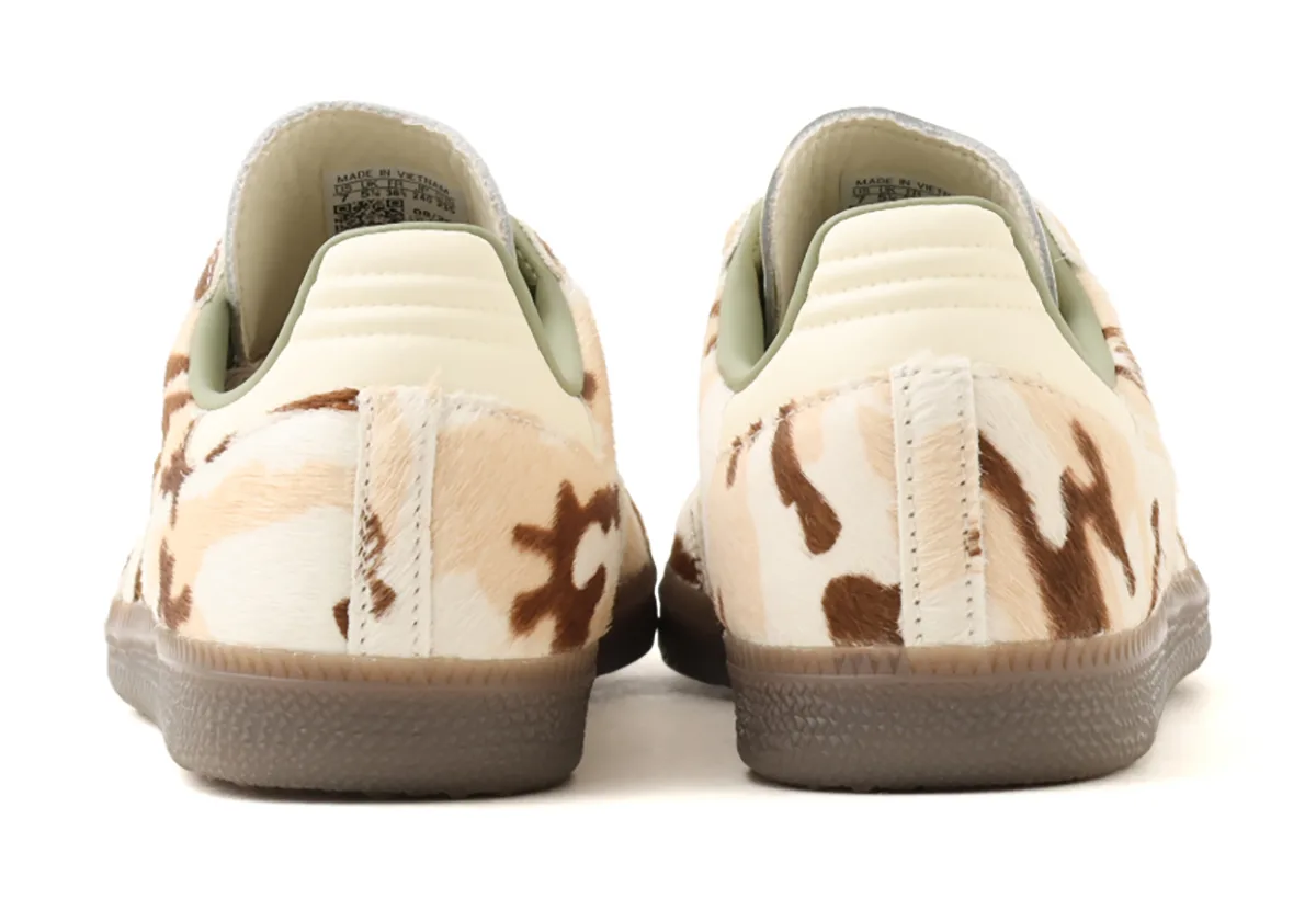 Pair from the heel showing camo pony hair, cream heel tabs, sage lining and gum soles, Camo Cow Print