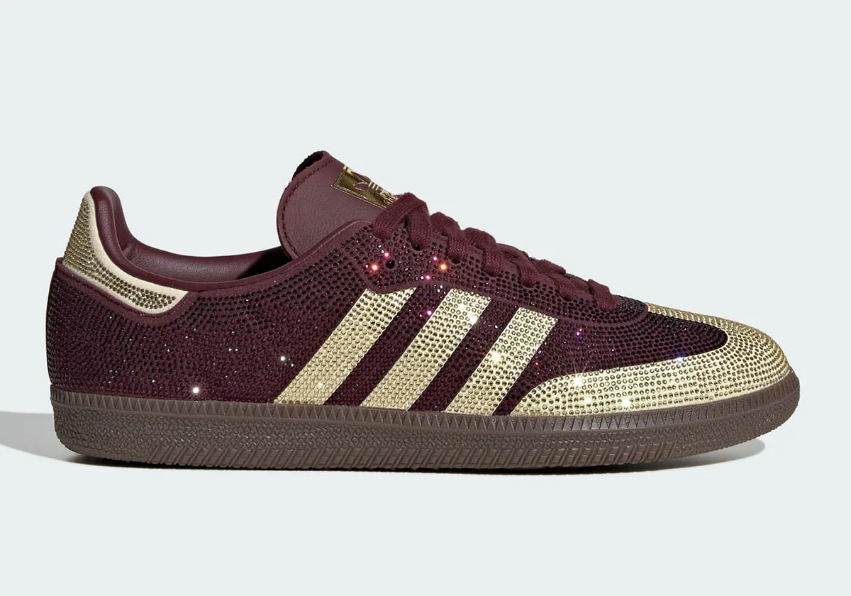 Lateral view on plain white, maroon crystal upper, gold stripes and toe, gum sole, Rhinestone