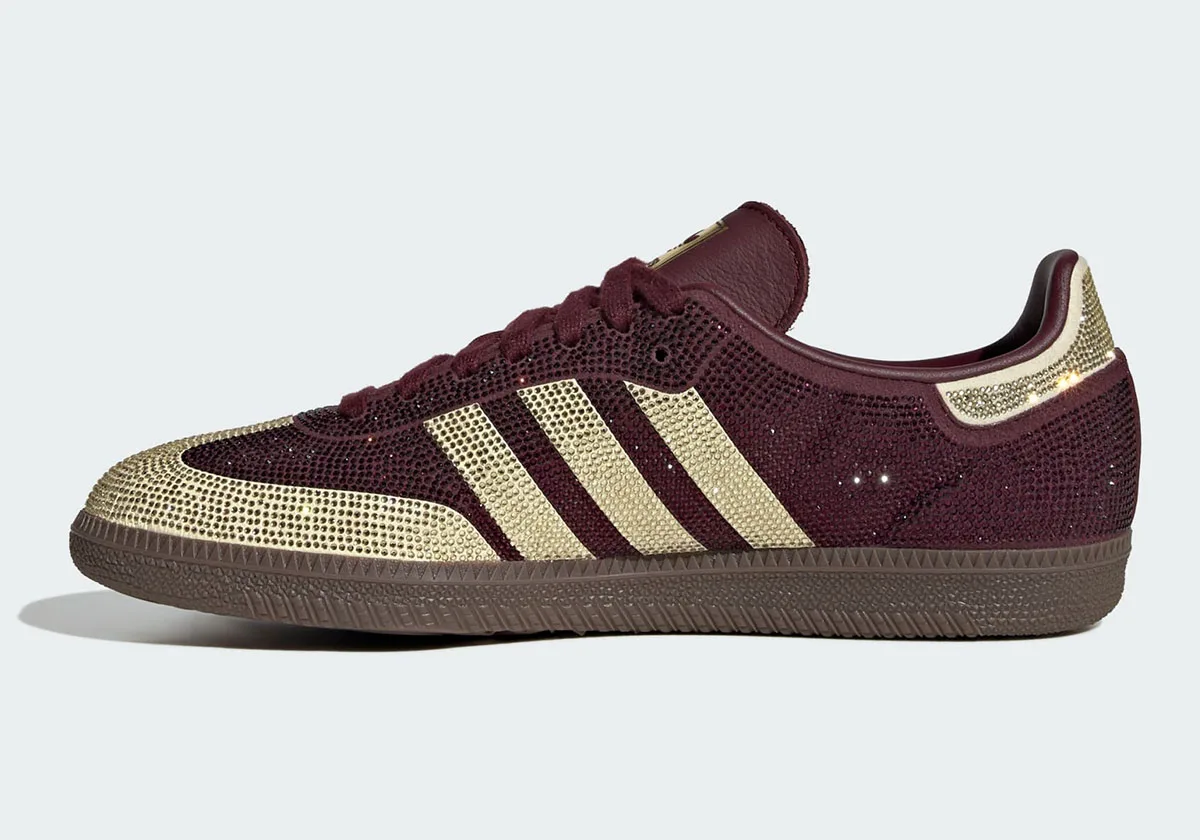 Medial view, gold crystal toe and stripes on maroon, gum sole, heel tab at right, Rhinestone