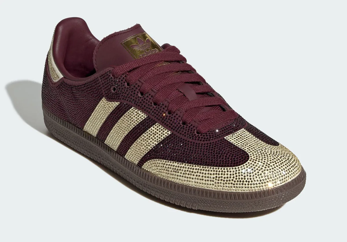 Three-quarter toe view, gold crystal toe cap and stripes on maroon, gold tongue label, Rhinestone