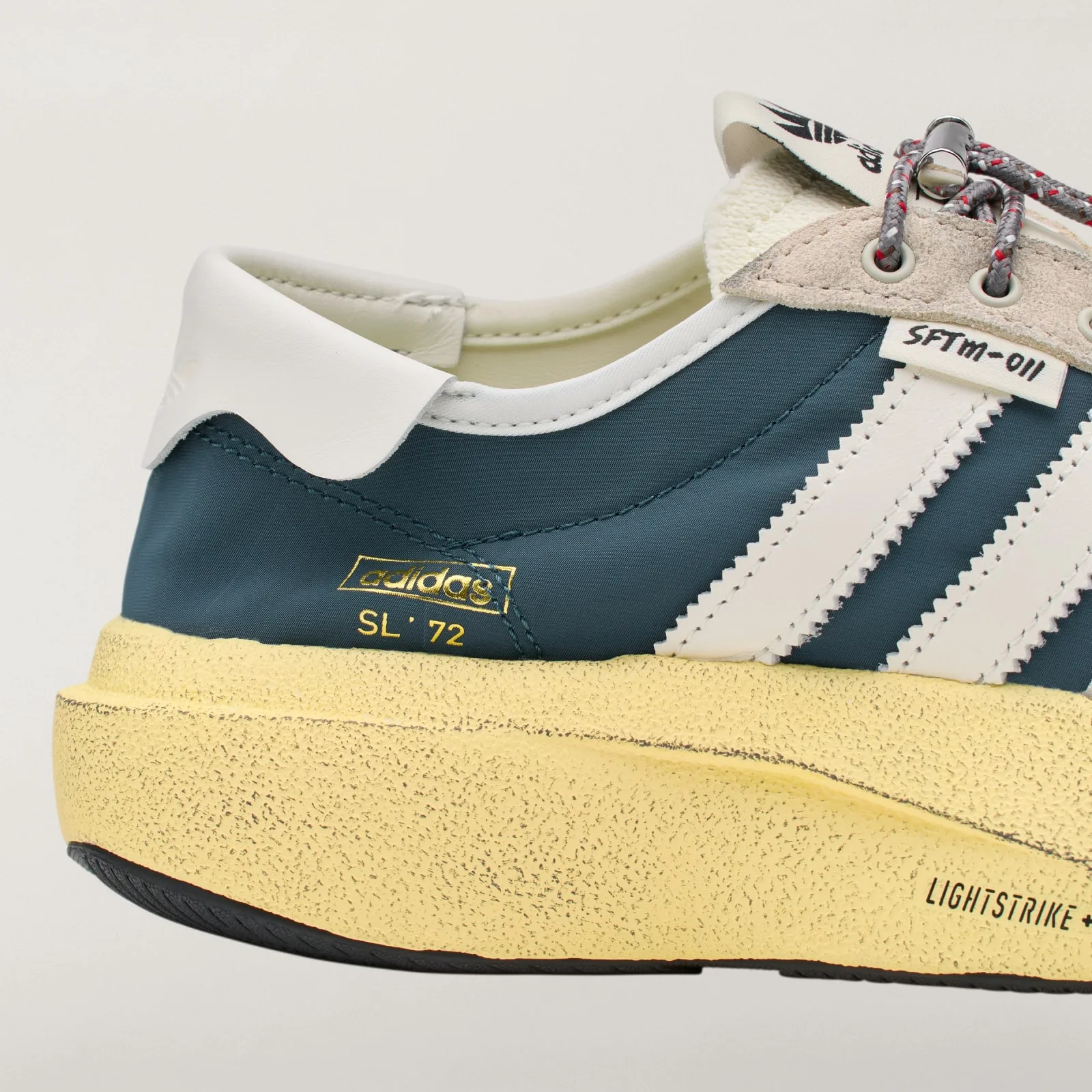 Heel detail with gold adidas SL 72 text and textured yellow midsole, Wild Teal