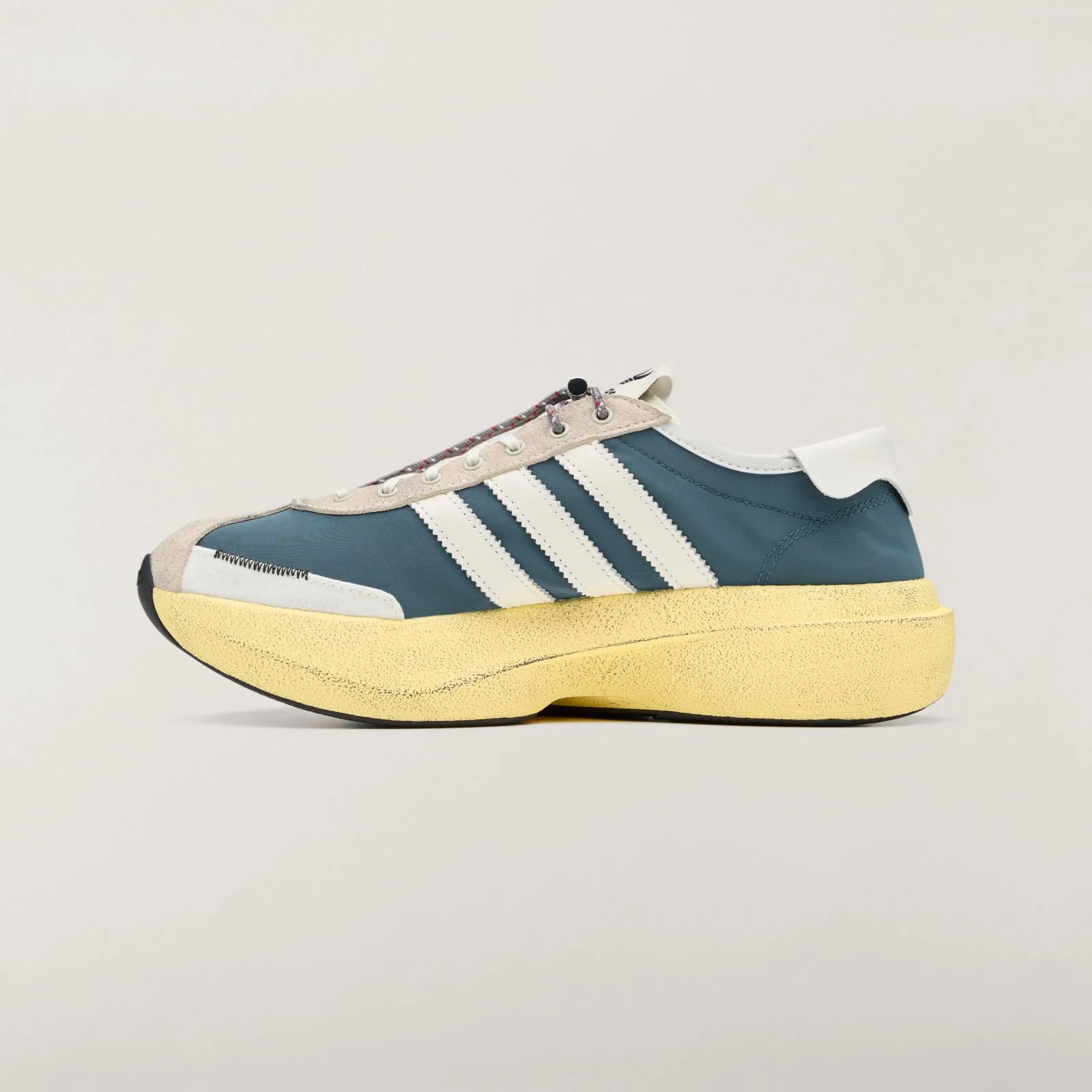 Medial view with teal upper, white stripes and beige suede toe overlay, Wild Teal