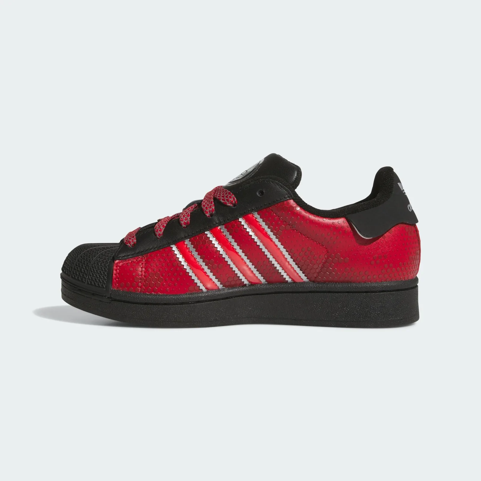 Medial view with red hexagon-patterned panels and silver-edged stripes, Ant Man