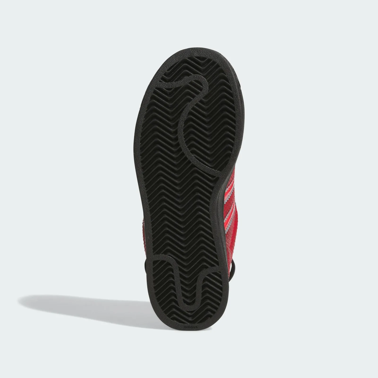 Outsole view with black herringbone tread and curved grooves, Ant Man