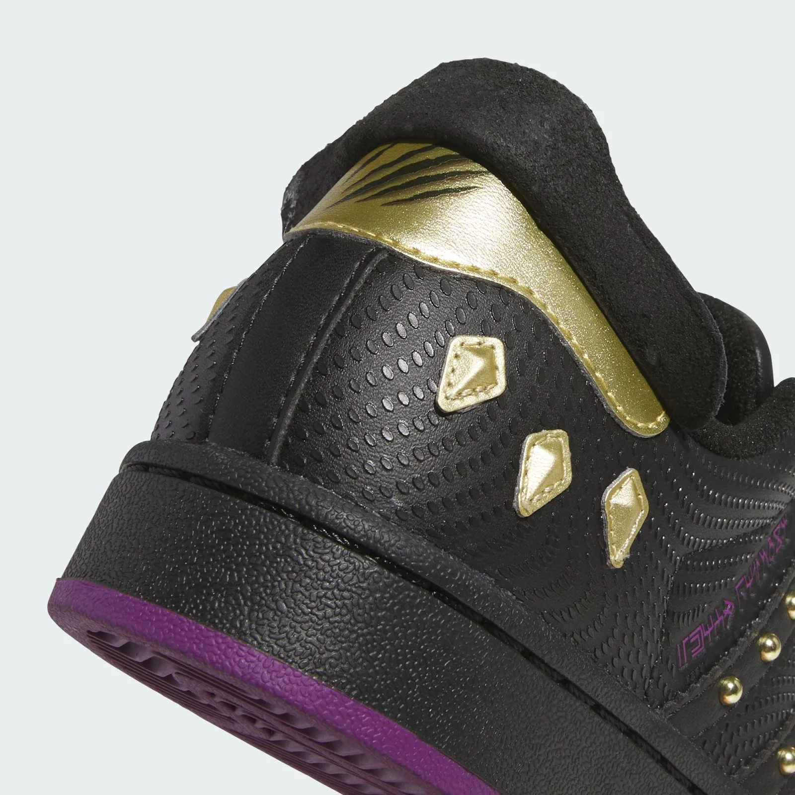 Heel detail with gold claw-shaped accents and a gold panel beneath the heel tab, Black Panther