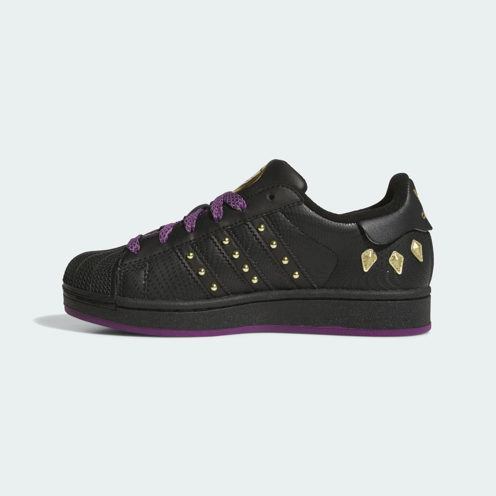 Medial view with gold-studded black stripes and a purple outsole edge, Black Panther