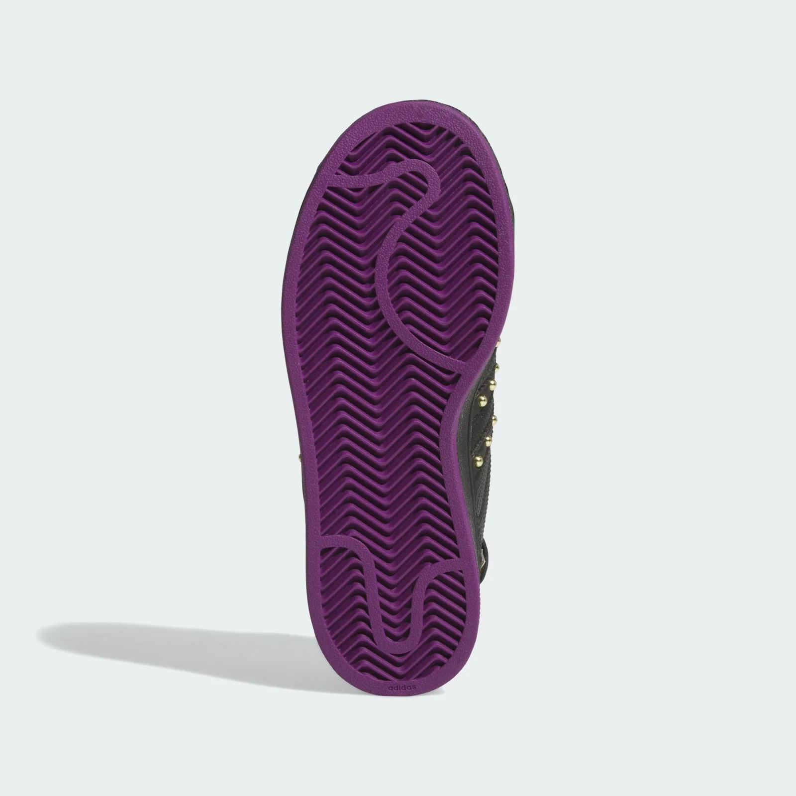 Outsole view with purple herringbone tread and curved grooves, Black Panther